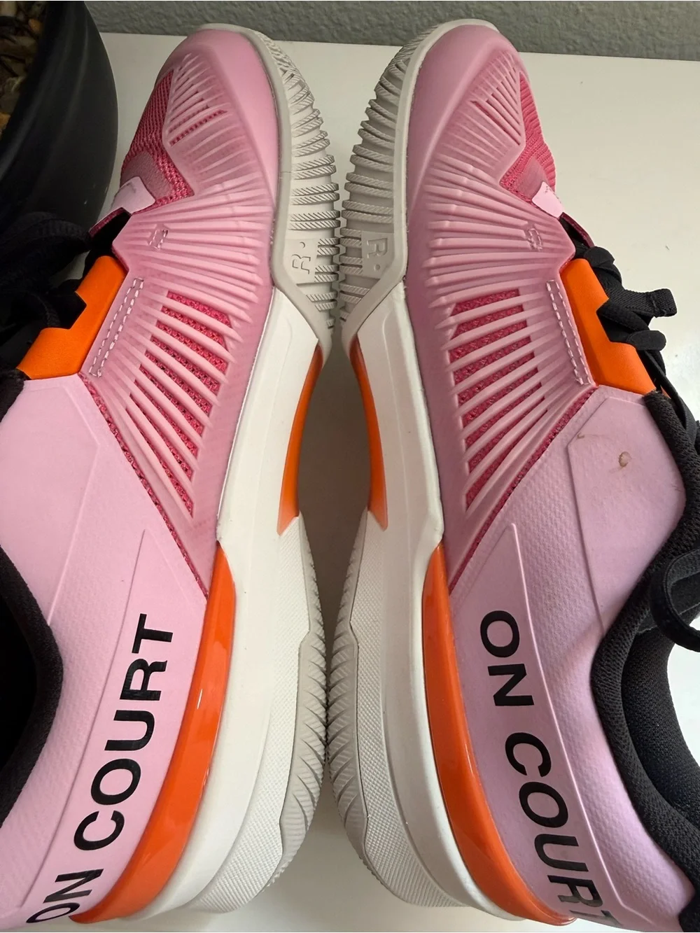 On the Roger pro fire men size 9  or women size 10 pink and Orange Men's Athleti